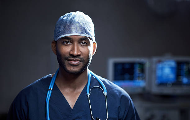 portrait of a confident young surgeon standing in an operating room portrait of a confident young surgeon standing in an operating room